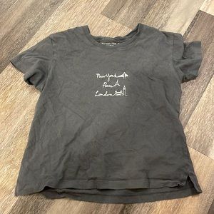 gray cropped baby tee with white locations